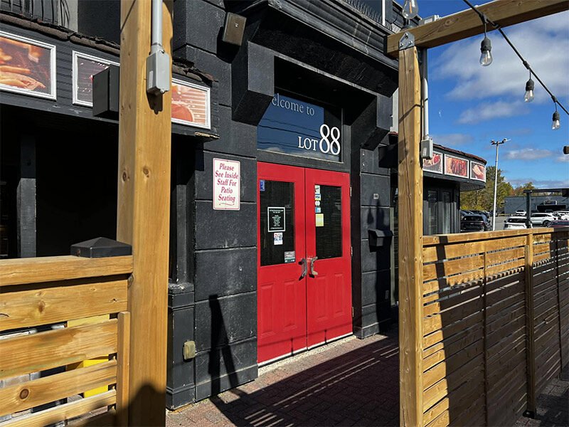 The red doors and patio entrance of Lot 88 Sudbury on the Kingsway